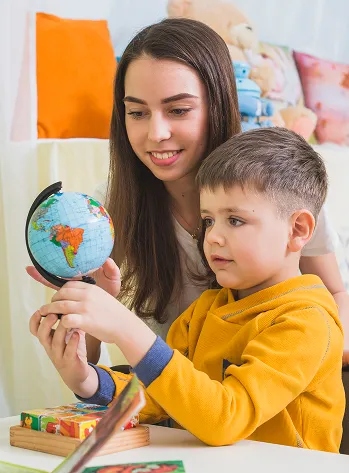 woman-boy-looking-globe